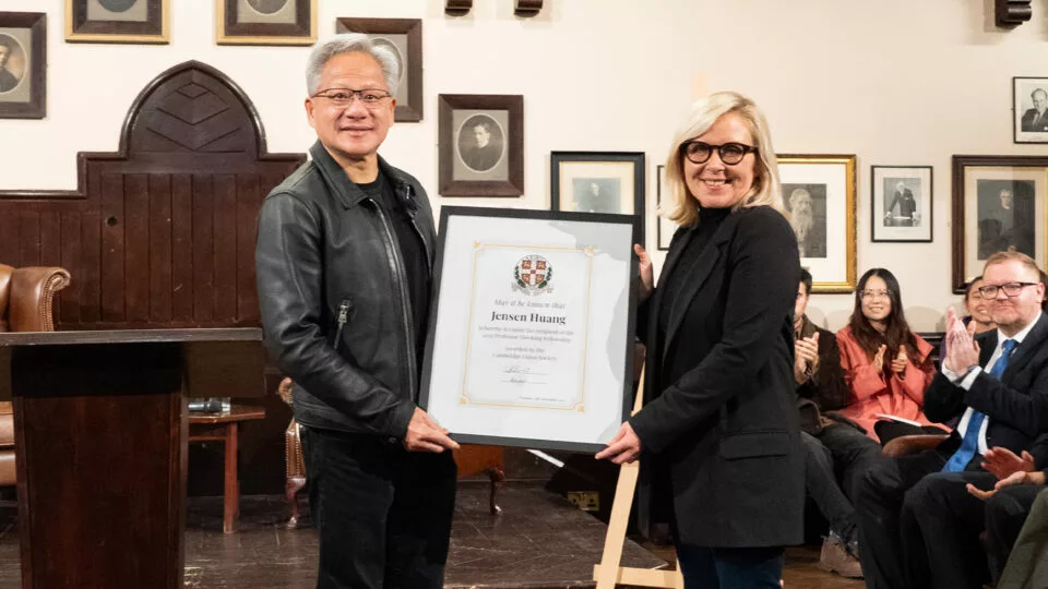 Lucy Hawking presents NVIDIA CEO Jensen Huang with the Professor Stephen Hawking Fellowship at Cambridge Union Society.